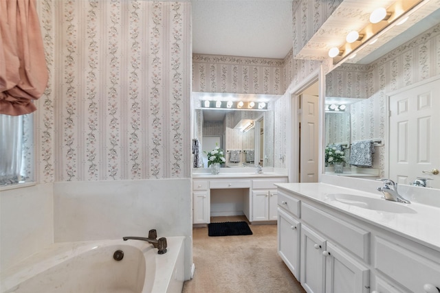 15118 Terrace Oaks Dr, Houston, TX 77068 - bathroom featuring wallpapered walls, two vanities, and a bath