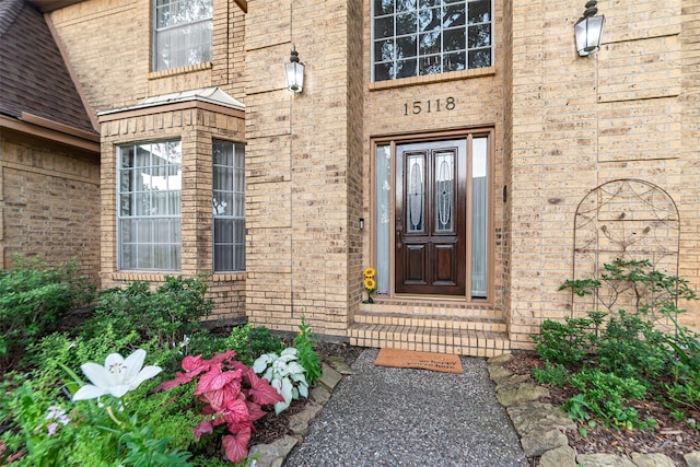 15118 Terrace Oaks Dr, Houston, TX 77068 - view of exterior entry featuring brick siding