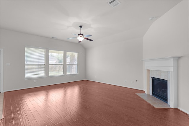 13406 Georgia Hollow Ct, Rosharon, TX 77583 - unfurnished living room with ceiling fan, wood finished floors, a tile fireplace, and baseboards