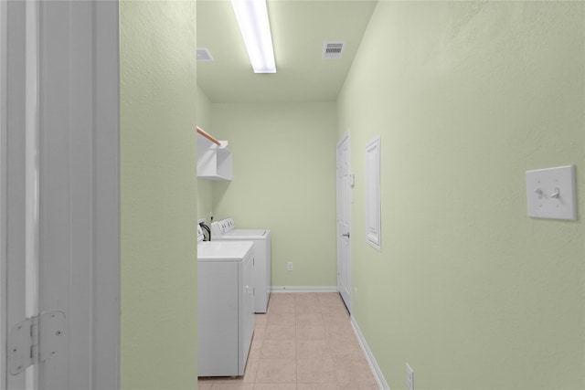 13406 Georgia Hollow Ct, Rosharon, TX 77583 - laundry room with separate washer and dryer, light tile patterned floors, and baseboards