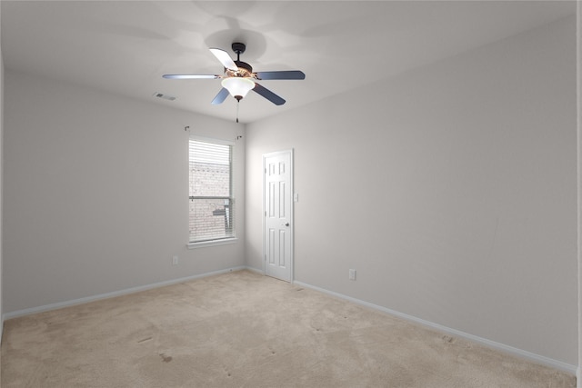 13406 Georgia Hollow Ct, Rosharon, TX 77583 - empty room with light colored carpet, ceiling fan, and baseboards