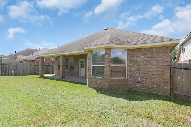 13406 Georgia Hollow Ct, Rosharon, TX 77583 - rear view of property featuring brick siding, roof with shingles, and a patio area