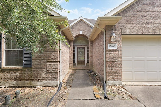 13406 Georgia Hollow Ct, Rosharon, TX 77583 - doorway to property featuring an attached garage and brick siding
