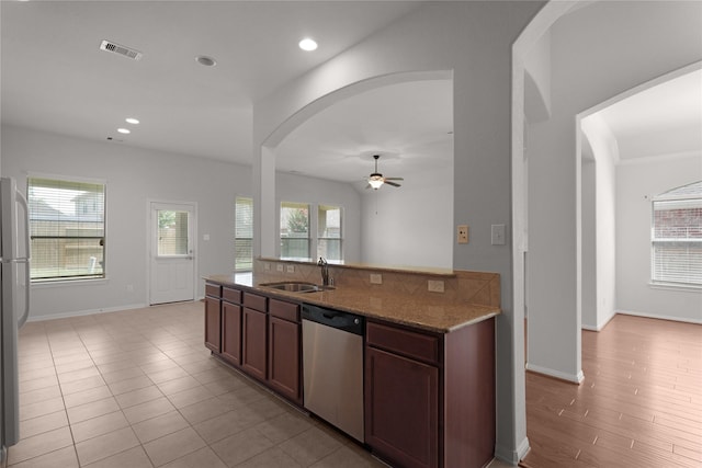 13406 Georgia Hollow Ct, Rosharon, TX 77583 - kitchen featuring stainless steel dishwasher, a sink, ceiling fan, healthy amount of natural light, and recessed lighting