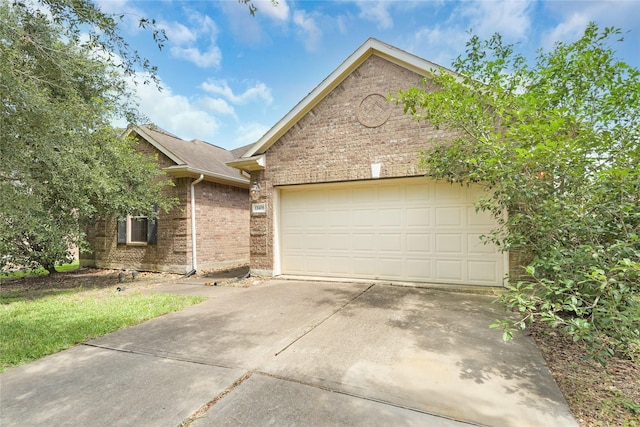 13406 Georgia Hollow Ct, Rosharon, TX 77583 - view of front of house featuring brick siding, an attached garage, driveway, and a shingled roof