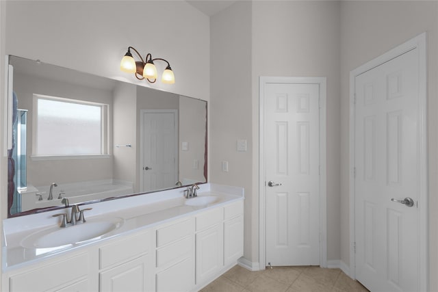 13406 Georgia Hollow Ct, Rosharon, TX 77583 - bathroom featuring double vanity, a garden tub, tile patterned flooring, and baseboards