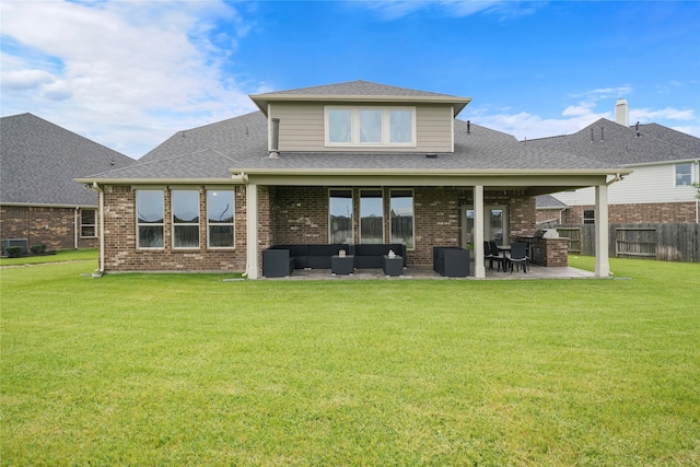 17011 Sweet Iris Ct, Conroe, TX 77302 - back of property featuring a patio, brick siding, outdoor lounge area, roof with shingles, and central air condition unit