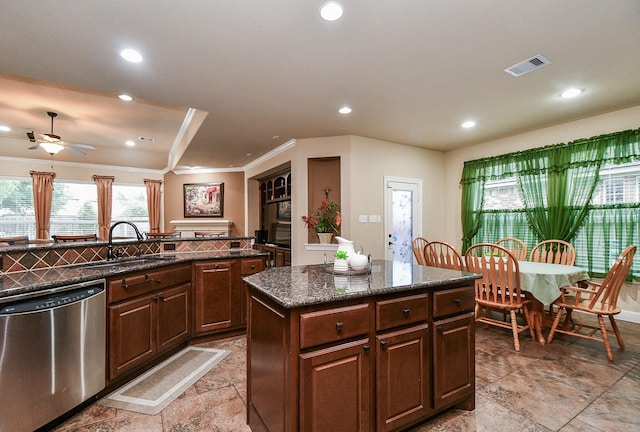 28030 Sugarside Glen Dr, Katy, TX 77494 - kitchen with stainless steel dishwasher, a sink, a center island, ceiling fan, and recessed lighting