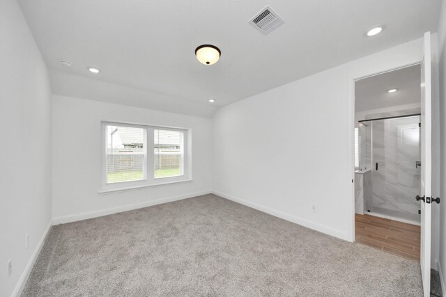 15885 Hayes Market Loop, Conroe, TX 77302 - unfurnished bedroom with carpet floors, recessed lighting, baseboards, and connected bathroom