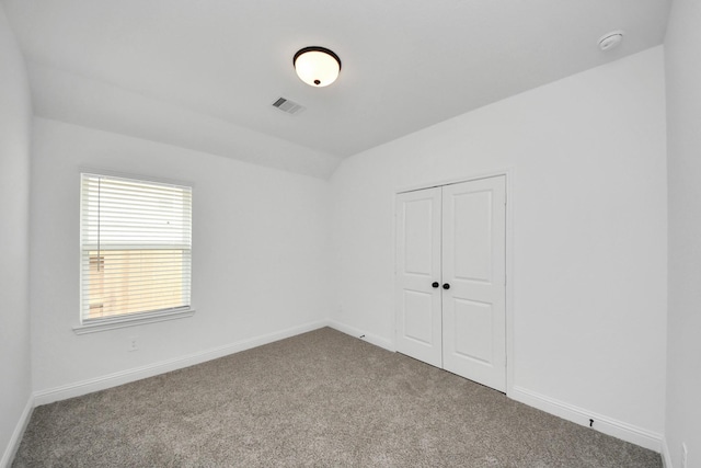 15885 Hayes Market Loop, Conroe, TX 77302 - carpeted spare room with vaulted ceiling, baseboards, and a smoke detector