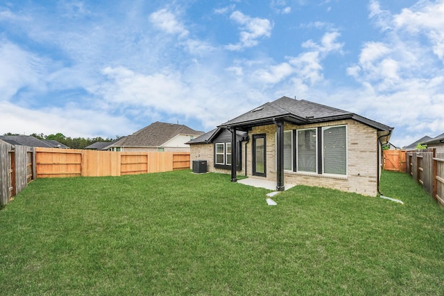 15885 Hayes Market Loop, Conroe, TX 77302 - rear view of house with brick siding and central AC unit