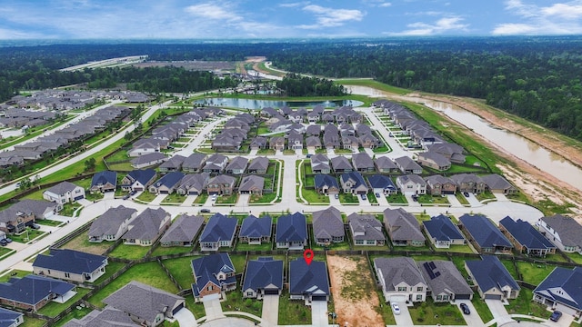 15885 Hayes Market Loop, Conroe, TX 77302 - view of property location featuring a large body of water, nearby suburban area, and a heavily wooded area