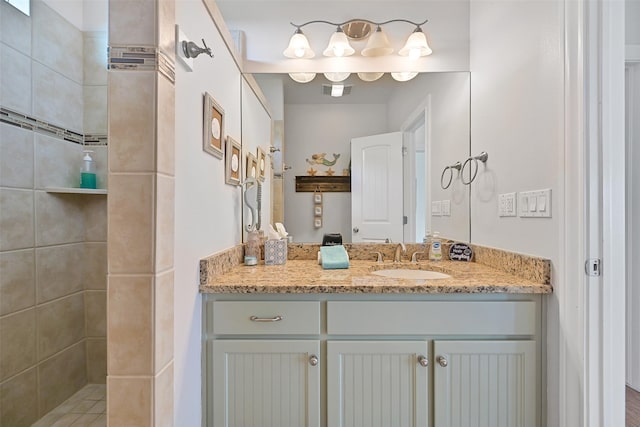 839 S Monkhouse Dr, Crystal Beach, TX 77650 - bathroom with vanity and tiled shower