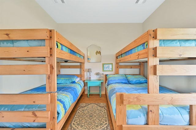 839 S Monkhouse Dr, Crystal Beach, TX 77650 - bedroom with lofted ceiling and wood finished floors