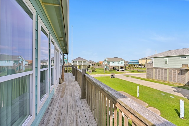839 S Monkhouse Dr, Crystal Beach, TX 77650 - wooden deck with a residential view and a yard