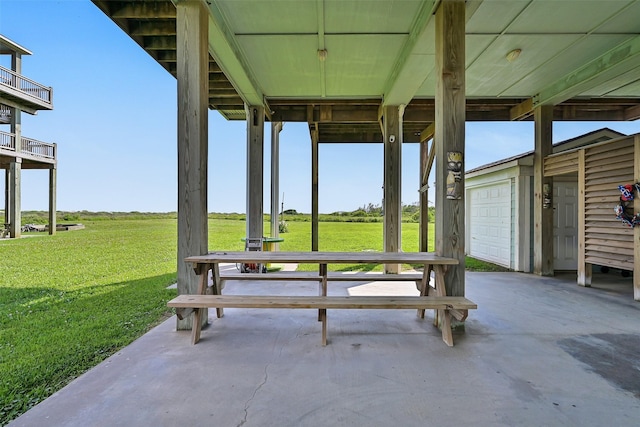 839 S Monkhouse Dr, Crystal Beach, TX 77650 - view of patio featuring a garage