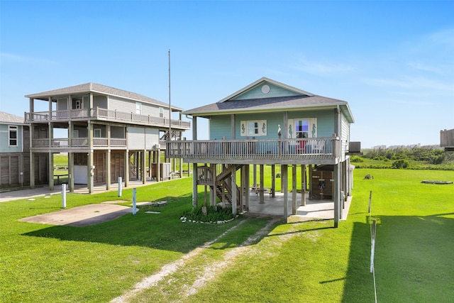 839 S Monkhouse Dr, Crystal Beach, TX 77650 - view of front of house with a carport, a front yard, driveway, and an area to practice putting