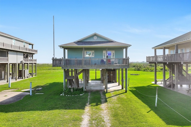 839 S Monkhouse Dr, Crystal Beach, TX 77650 - back of property featuring stairs, a patio area, a yard, and a deck