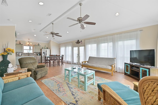 839 S Monkhouse Dr, Crystal Beach, TX 77650 - living area with healthy amount of natural light, ceiling fan, crown molding, light wood finished floors, and recessed lighting