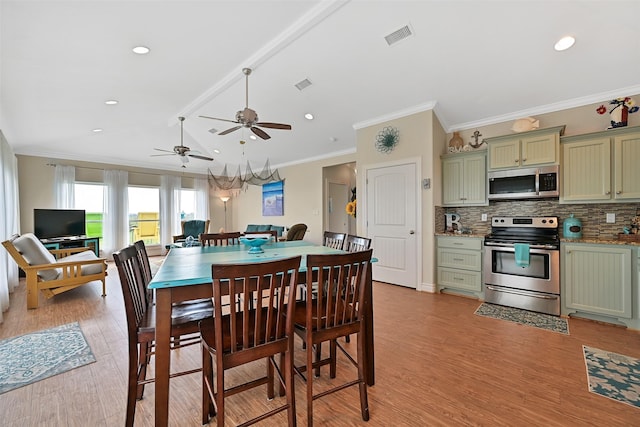 839 S Monkhouse Dr, Crystal Beach, TX 77650 - dining room with light wood-type flooring, ornamental molding, recessed lighting, and a ceiling fan