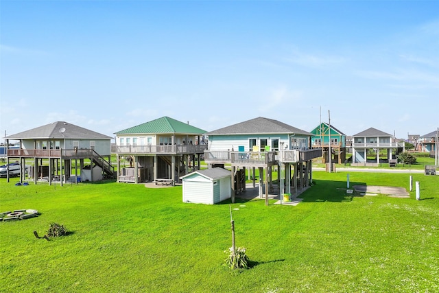 839 S Monkhouse Dr, Crystal Beach, TX 77650 - rear view of property with stairway, a wooden deck, and a yard