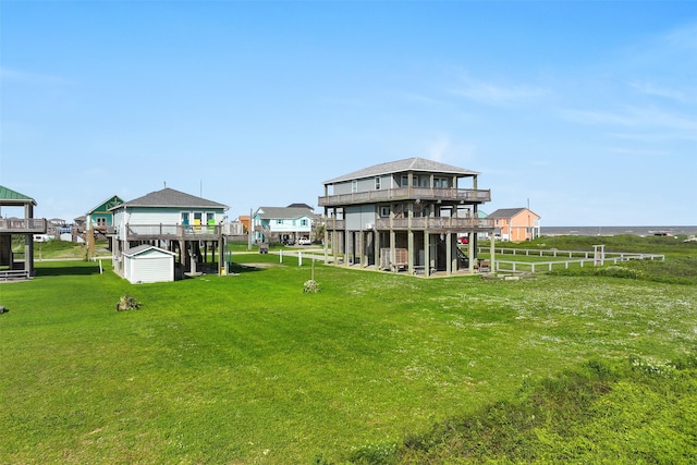 839 S Monkhouse Dr, Crystal Beach, TX 77650 - view of grassy yard with a deck and an outbuilding
