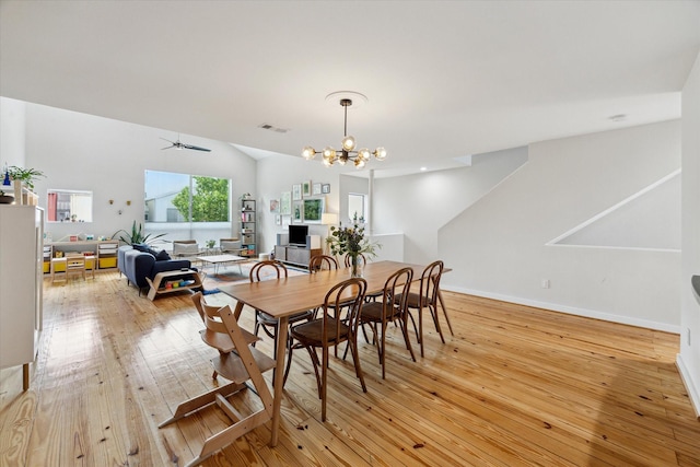646 Lester St, Houston, TX 77007 - dining area featuring light wood finished floors, a chandelier, vaulted ceiling, a ceiling fan, and baseboards
