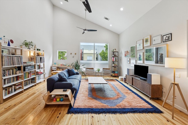 646 Lester St, Houston, TX 77007 - living area with ceiling fan, hardwood / wood-style floors, high vaulted ceiling, and recessed lighting