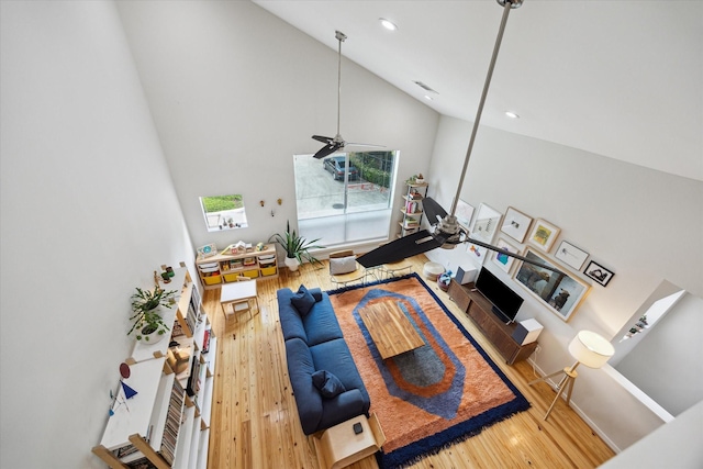 646 Lester St, Houston, TX 77007 - living room with high vaulted ceiling, wood finished floors, recessed lighting, and a ceiling fan