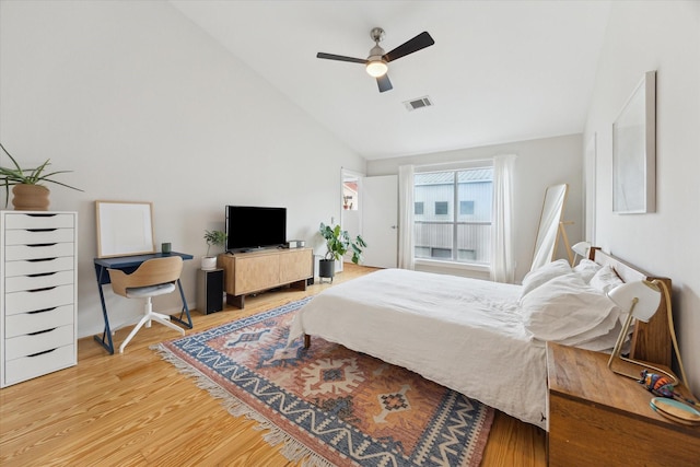646 Lester St, Houston, TX 77007 - bedroom with light wood-style flooring, lofted ceiling, and a ceiling fan