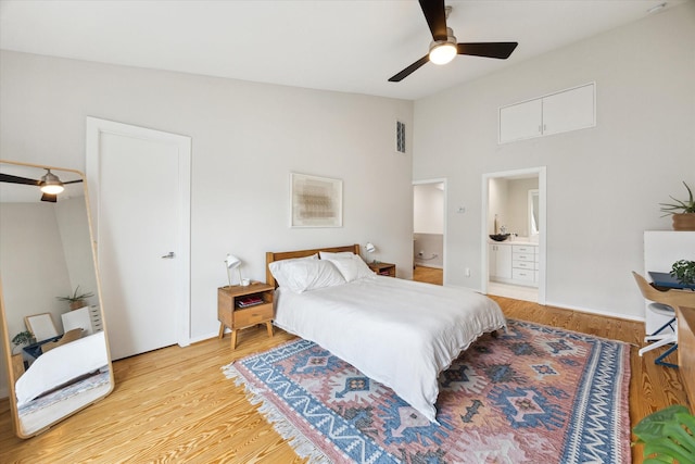 646 Lester St, Houston, TX 77007 - bedroom with ensuite bathroom, wood finished floors, high vaulted ceiling, and a ceiling fan