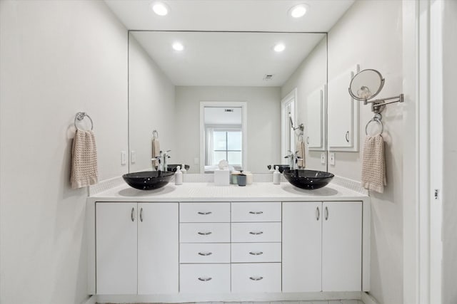 646 Lester St, Houston, TX 77007 - bathroom featuring double vanity and recessed lighting