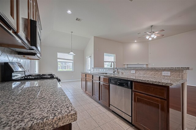 3934 Medici Ct, Missouri City, TX 77459 - kitchen featuring stainless steel dishwasher, a sink, stove, ceiling fan, and dark brown cabinets