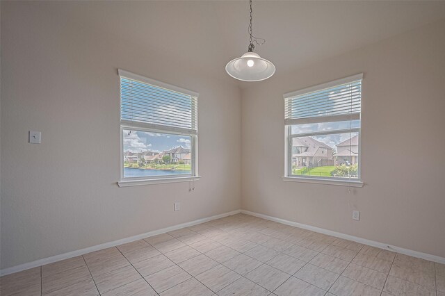 3934 Medici Ct, Missouri City, TX 77459 - spare room with healthy amount of natural light, light tile patterned floors, and baseboards