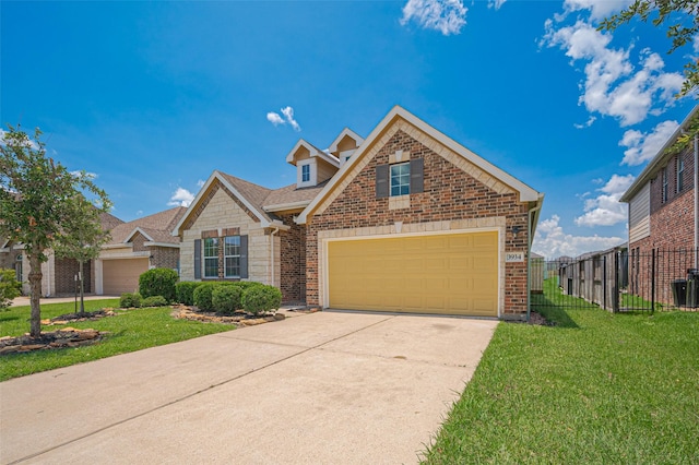 3934 Medici Ct, Missouri City, TX 77459 - traditional-style home with driveway, brick siding, stone siding, and an attached garage