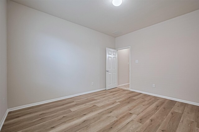 3934 Medici Ct, Missouri City, TX 77459 - spare room with light wood-type flooring and baseboards