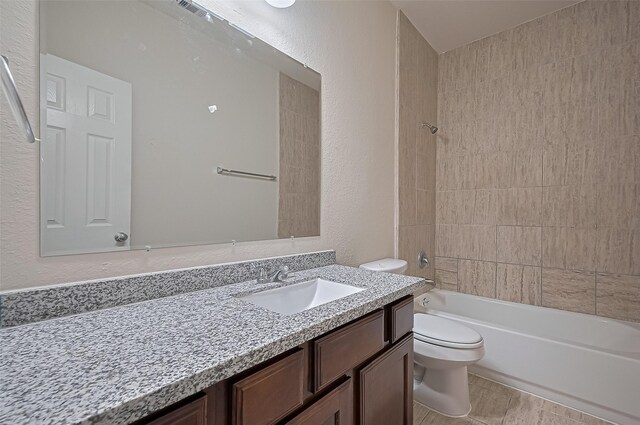 3934 Medici Ct, Missouri City, TX 77459 - full bath with toilet, vanity, shower / washtub combination, and a textured wall