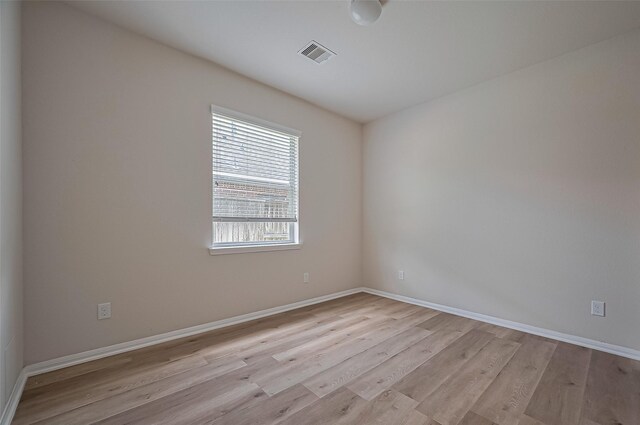 3934 Medici Ct, Missouri City, TX 77459 - empty room with light wood-style floors and baseboards