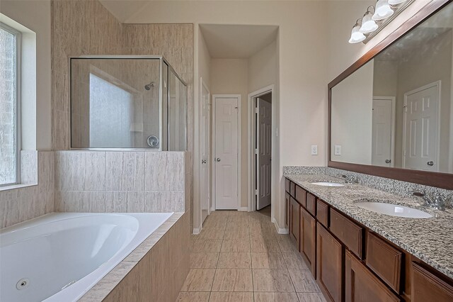 3934 Medici Ct, Missouri City, TX 77459 - bathroom with a stall shower, a garden tub, double vanity, and tile patterned floors