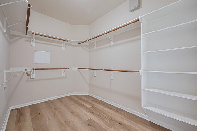 3934 Medici Ct, Missouri City, TX 77459 - walk in closet with wood finished floors