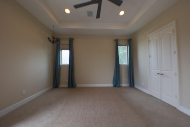 1205 Sampson St, Houston, TX 77003 - spare room with a tray ceiling, recessed lighting, carpet, and a ceiling fan