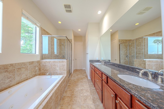 1205 Sampson St, Houston, TX 77003 - bathroom with a stall shower, a whirlpool tub, double vanity, and recessed lighting