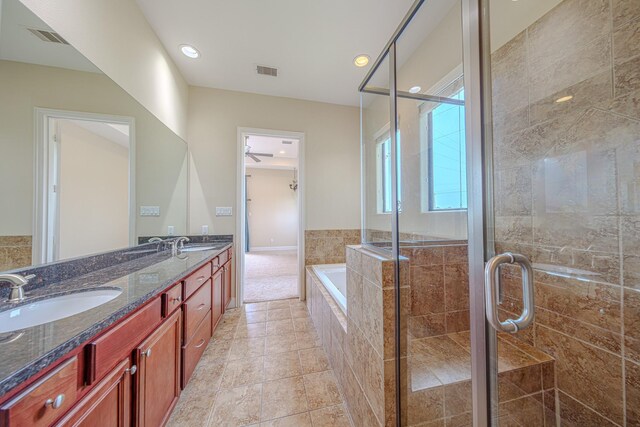 1205 Sampson St, Houston, TX 77003 - full bath with a bath, double vanity, a shower stall, and recessed lighting