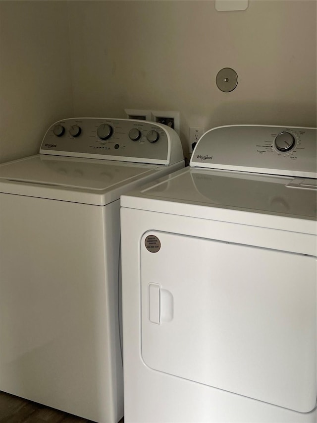 15508 Taylorcrest Dr, Conroe, TX 77306 - laundry area with washing machine and clothes dryer and dark wood finished floors