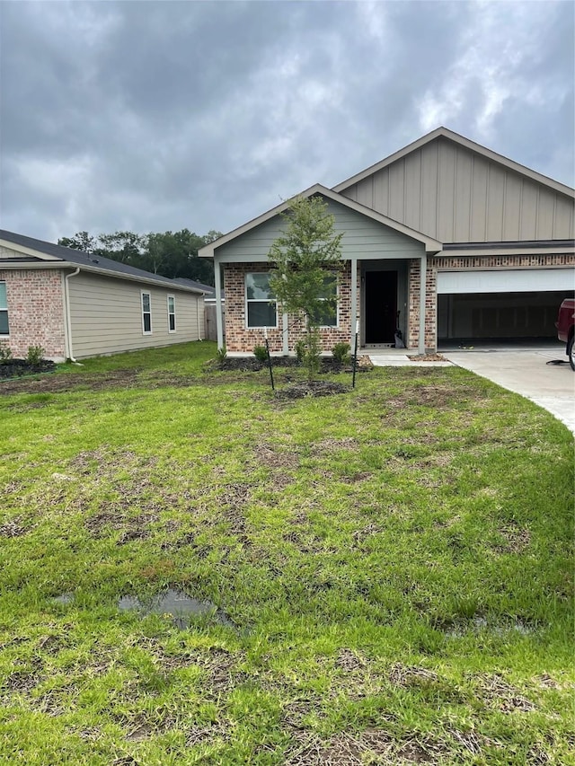 15508 Taylorcrest Dr, Conroe, TX 77306 - ranch-style home with an attached garage, a front lawn, concrete driveway, and brick siding
