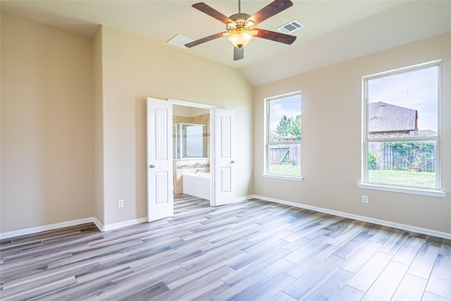 8138 Heartbrook Field Ln, Cypress, TX 77433 - spare room featuring light wood finished floors, a ceiling fan, and lofted ceiling