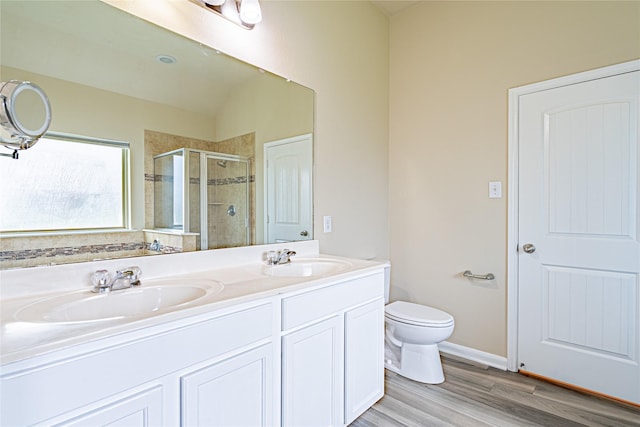 8138 Heartbrook Field Ln, Cypress, TX 77433 - full bathroom featuring a shower stall, double vanity, and wood finished floors
