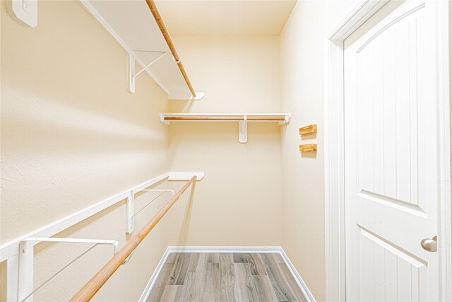 8138 Heartbrook Field Ln, Cypress, TX 77433 - spacious closet with wood finished floors