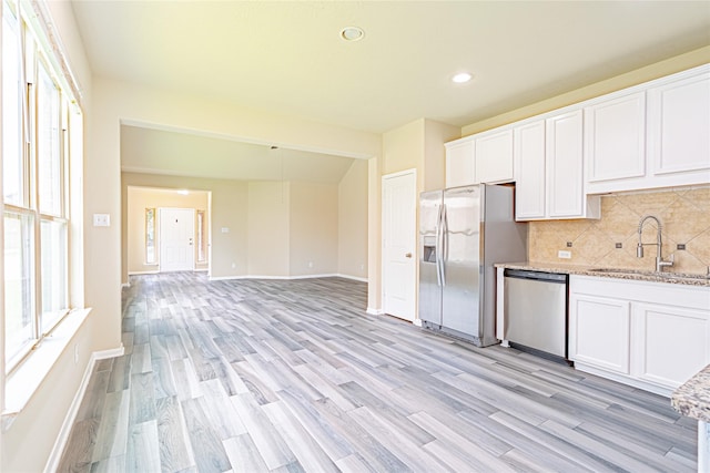 8138 Heartbrook Field Ln, Cypress, TX 77433 - kitchen featuring stainless steel appliances, healthy amount of natural light, light wood-style flooring, and recessed lighting