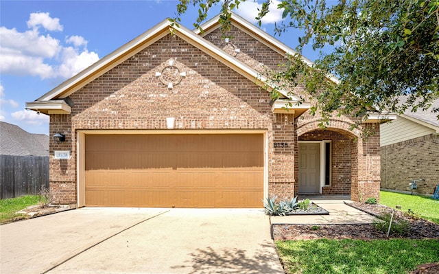 8138 Heartbrook Field Ln, Cypress, TX 77433 - view of front of home featuring brick siding, concrete driveway, and an attached garage